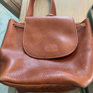 Portland Leather. Used. Outside is excellent. Inside has some marks.